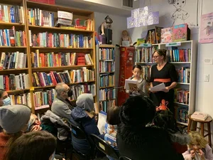 Image of student reading to an audience